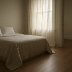 Sunlit bedroom with cooler floor area near the bed